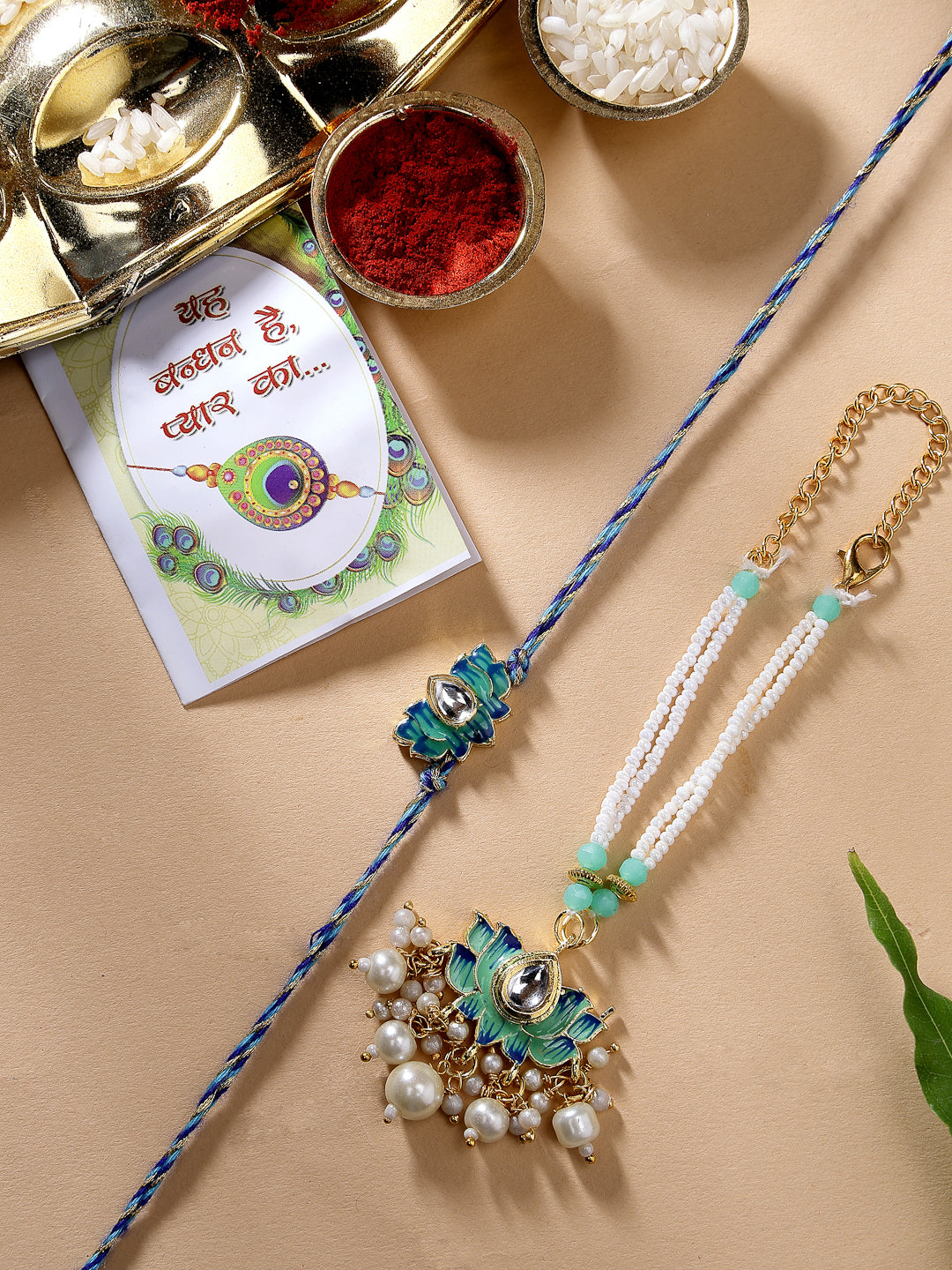 Set Of 2 Turquoise Blue Lotus Shape Kundan-Studded & Beaded Rakhi Set With Roli Chawal & Chocolate