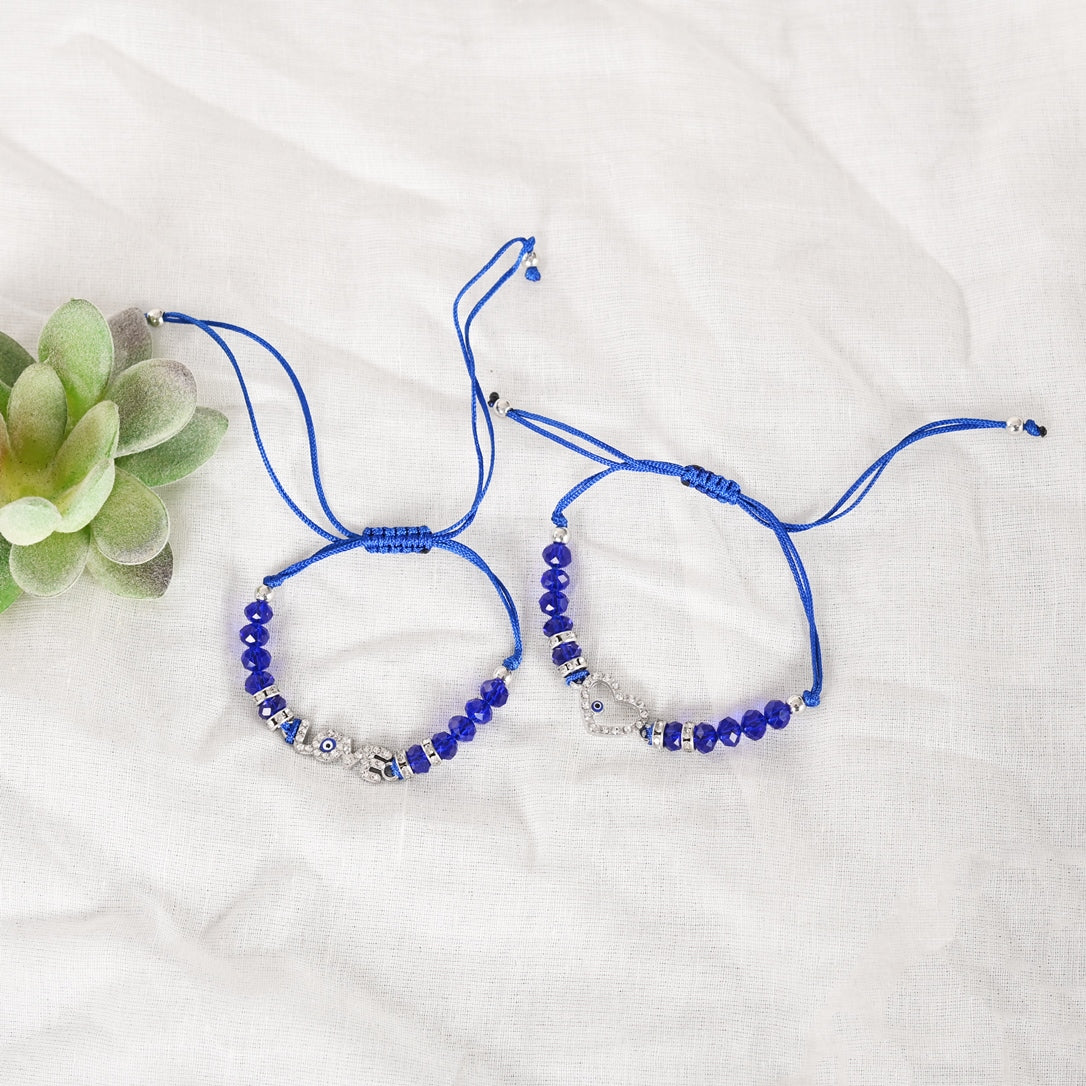 Set Of 2 Blue Evil Eye Rakhi With Roli Chawal