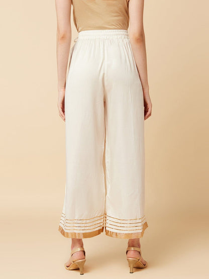 Women's Off-White Flared Solid Palazzos
