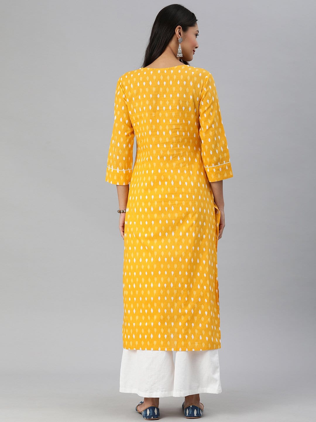 Women's KSUT Mustard And White Ikkat Printed Straight Kurta With Dori And Tassel Detailing On Neckline
