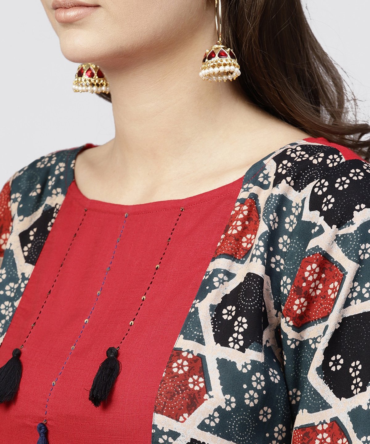 Women's Red Cotton Full Sleeves Kurti With An Attached Jacket And Emblished With Thread Work And Tassel