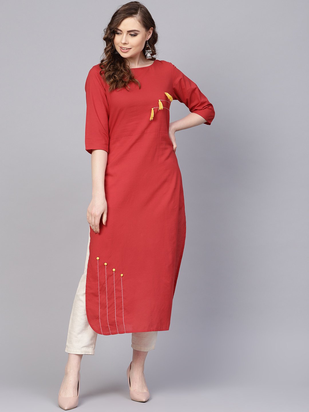 Women's Solid Red Kurta With Thread Stitch And Tassels Detailing With A Round Neck And 3/4Th Sleeves