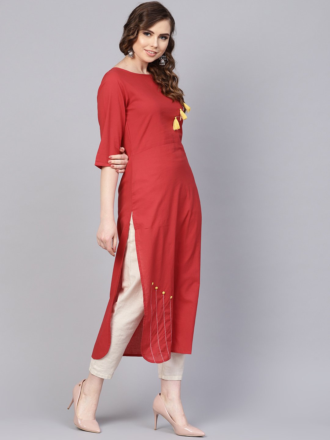 Women's Solid Red Kurta With Thread Stitch And Tassels Detailing With A Round Neck And 3/4Th Sleeves