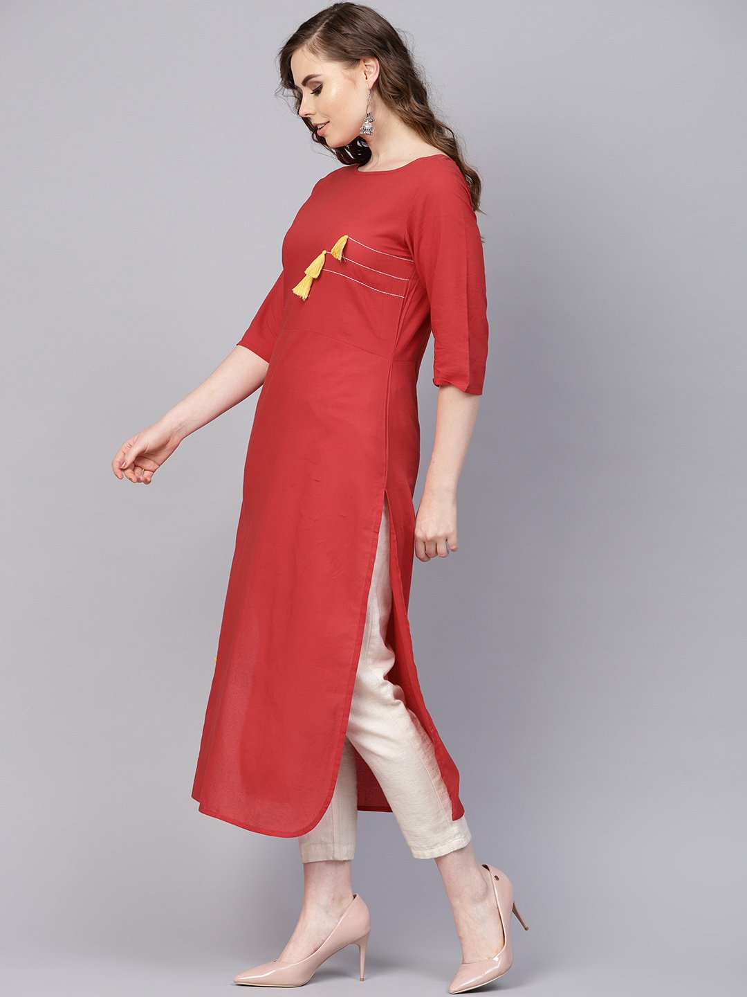 Women's Solid Red Kurta With Thread Stitch And Tassels Detailing With A Round Neck And 3/4Th Sleeves