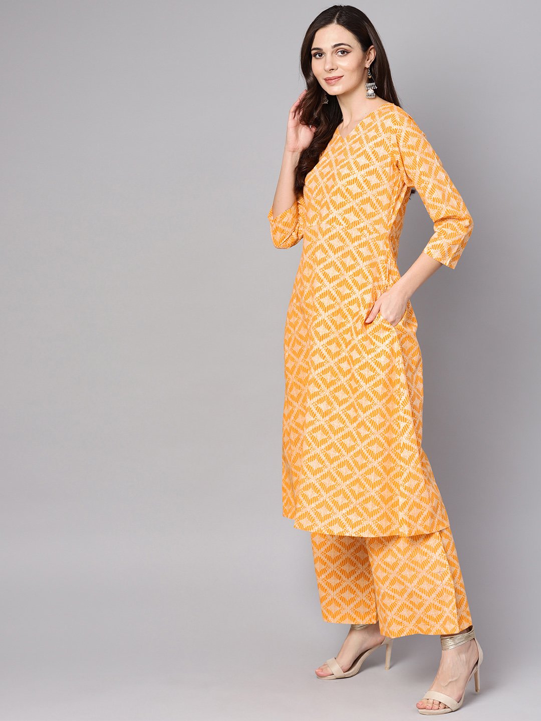 Women's Yellow Geometric Printed Kurta Set With Flared Palazzo