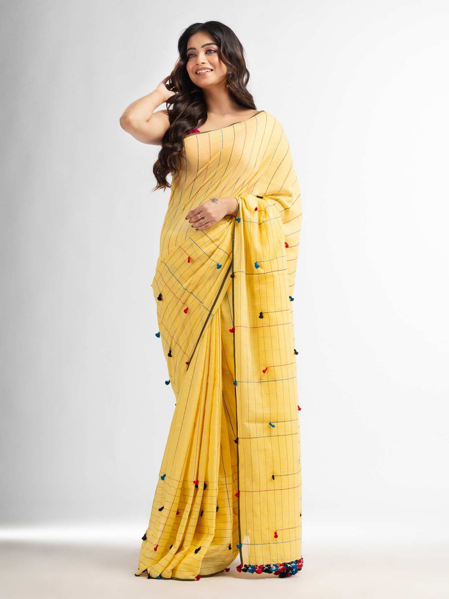 Women's Yellow cotton saree with multi colour thread weave and tassels