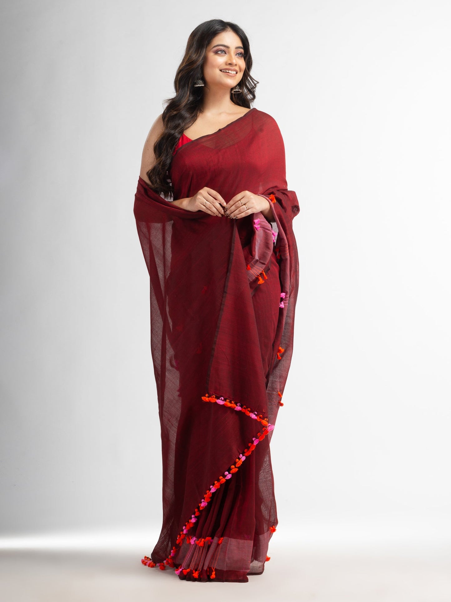 Women's Meroon cotton saree with multi colour thread weave and tassels