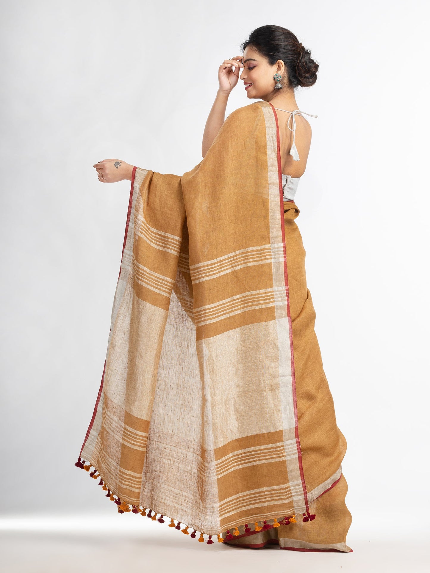 Women's saffron with silver zari pallu in silver zari border handwoven linen saree