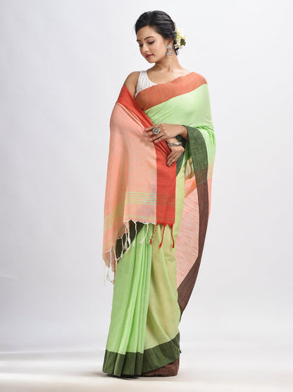 Women's Light green cotton with solid body in tawny peach pallu handloom saree