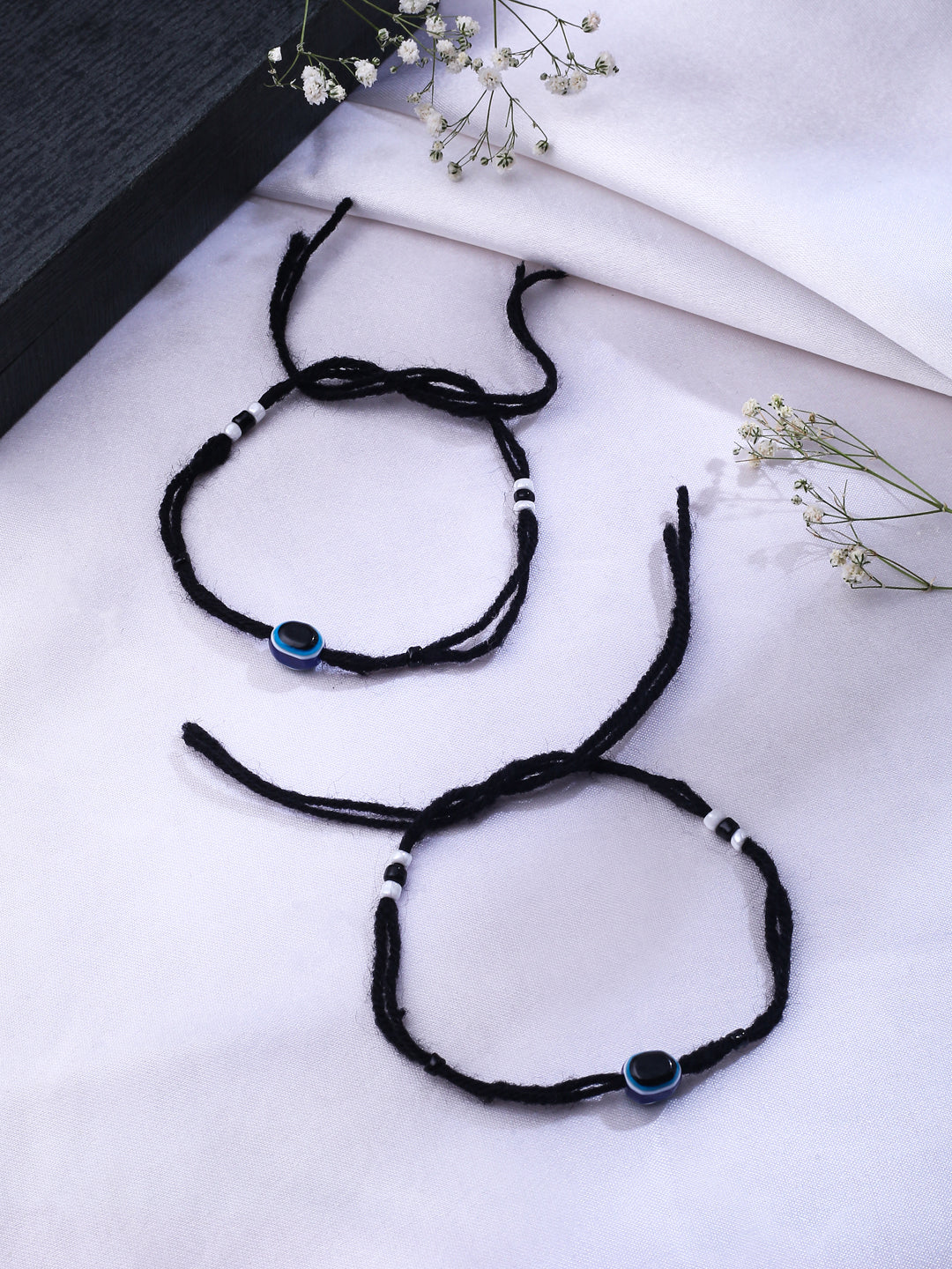 Set Of 2 Black Evil Eye Rakhi With Roli Chawal