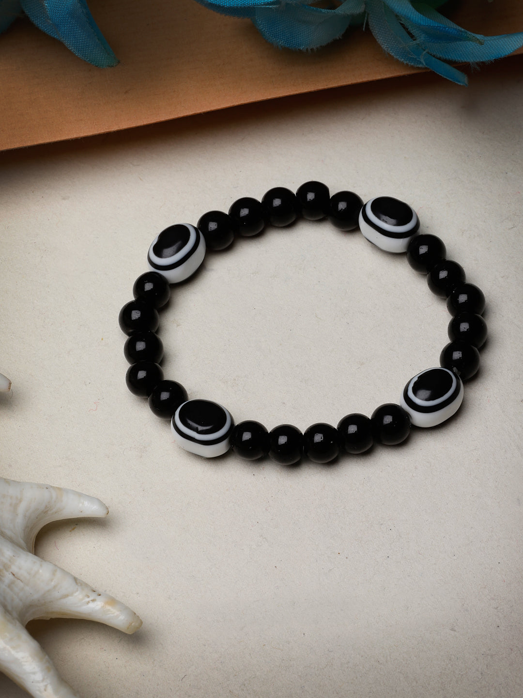 Black Evil Eye Elasticated Rakhi With Roli Chawal