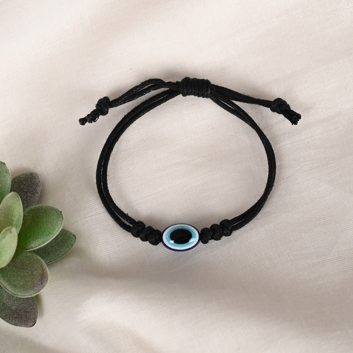 Black Evil Eye Rakhi With Roli Chawal
