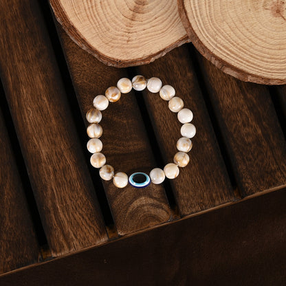 Cream-Colored Evil Eye Elasticated Rakhi With Roli Chawal