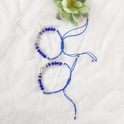 Set Of 2 Blue Evil Eye Rakhi With Roli Chawal