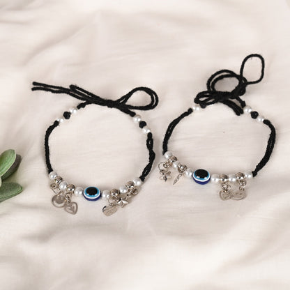 Set Of 2 Black Evil Eye Rakhi With Roli Chawal
