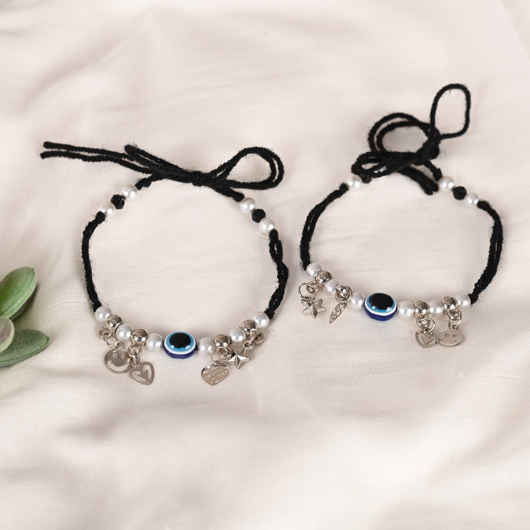 Set Of 2 Black Evil Eye Rakhi With Roli Chawal