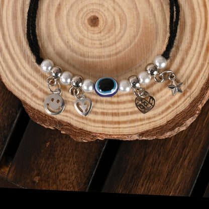Set Of 2 Black Evil Eye Rakhi With Roli Chawal