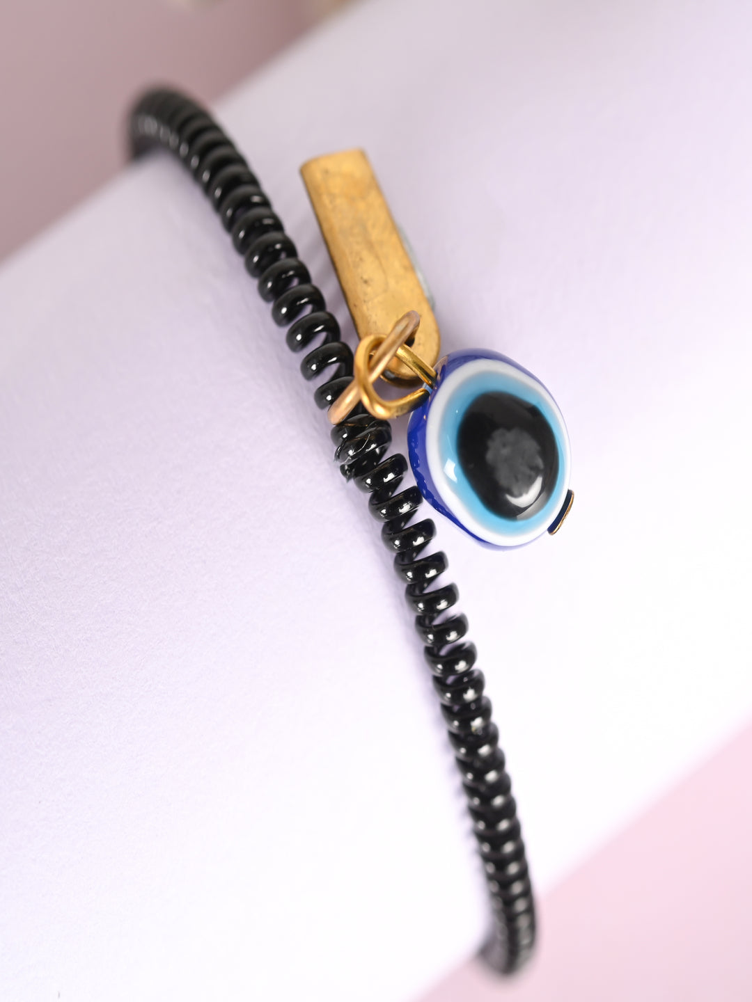 Black Evil Eye Spring Ring Rakhi With Roli Chawal