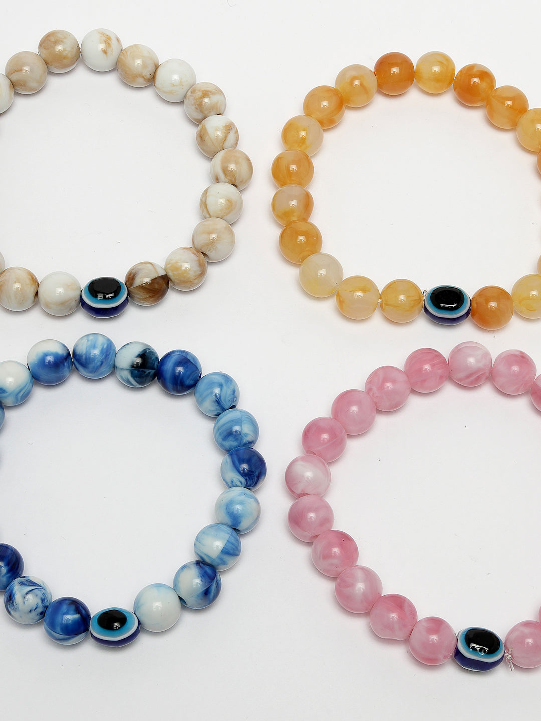 Set Of 4 Multicolor Evil Eye Elasticated Rakhi With Roli Chawal