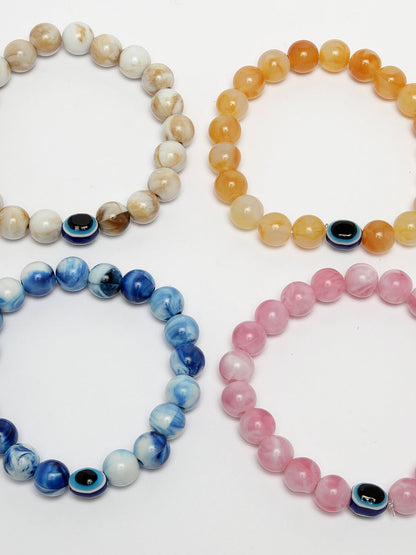 Set Of 4 Multicolor Evil Eye Elasticated Rakhi With Roli Chawal