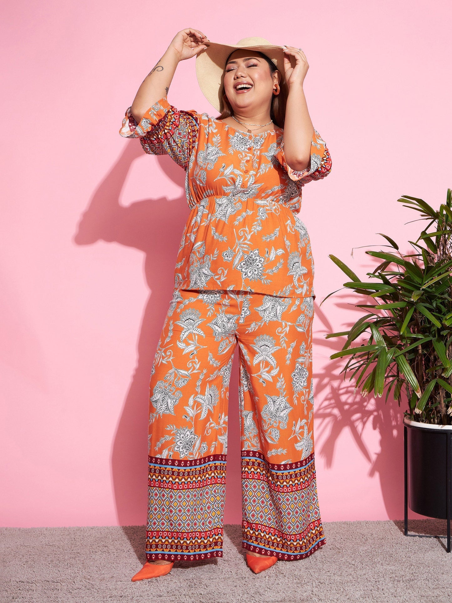 Women's Orange Floral Peplum Top With Straight Pants